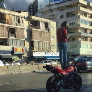 this guy had to stop and text everyone about the building with curtains on the outside