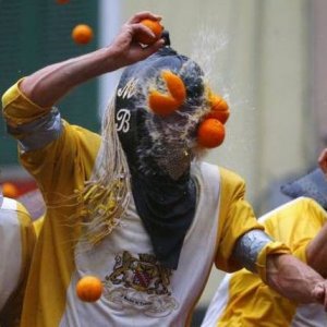 either a professional food fighting competition or someone has a weird way to make oj