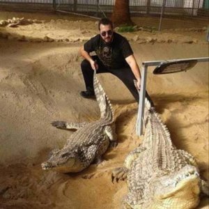 this guy fights dudes by swinging crocodiles over his head