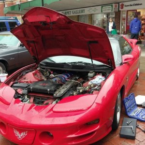 Dan taking the rocker covers off to investigate noises.