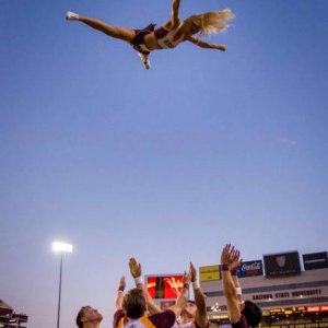 to get more attendance they started dropping cheerleaders from airplanes