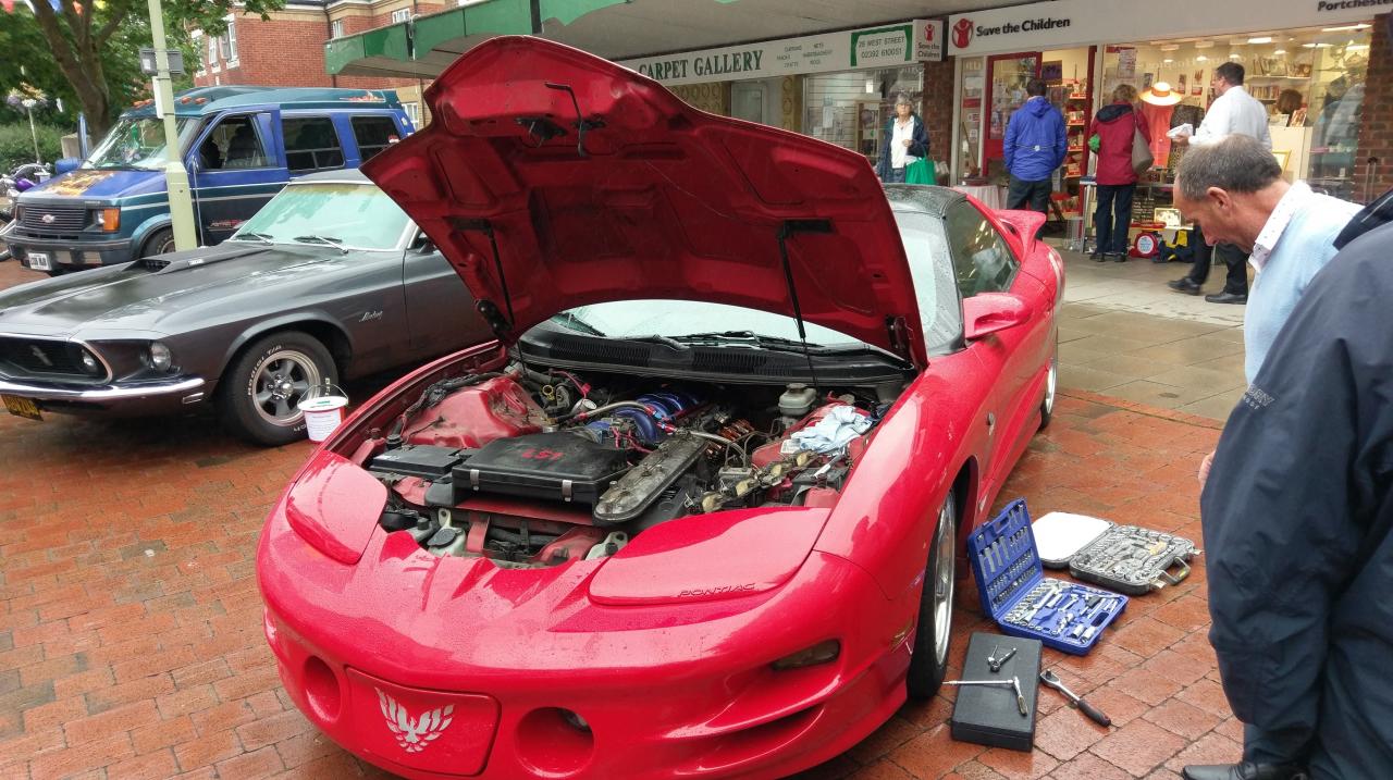 Dan taking the rocker covers off to investigate noises.