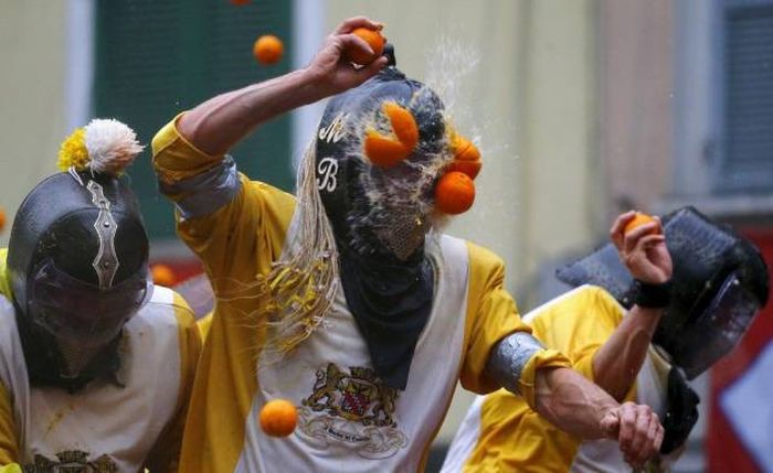 either a professional food fighting competition or someone has a weird way to make oj