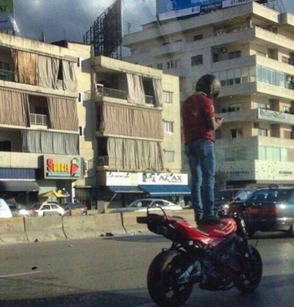 this guy had to stop and text everyone about the building with curtains on the outside