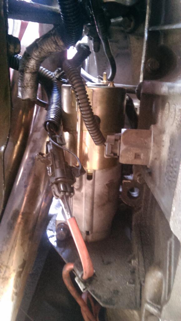 Two bolts hold it on, its all in, checking wires, away from exhaust and nothing caught.